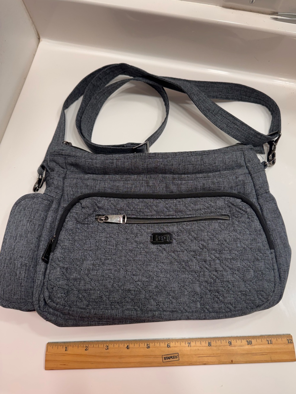 Lug brand Shimmy Crossbody Bag. Great for travel. Adjustable strap. Like New.
